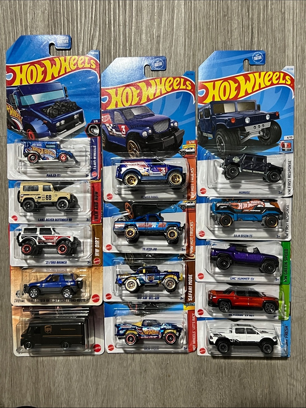 14) Assorted Hot Wheels & Matchbox Trucks